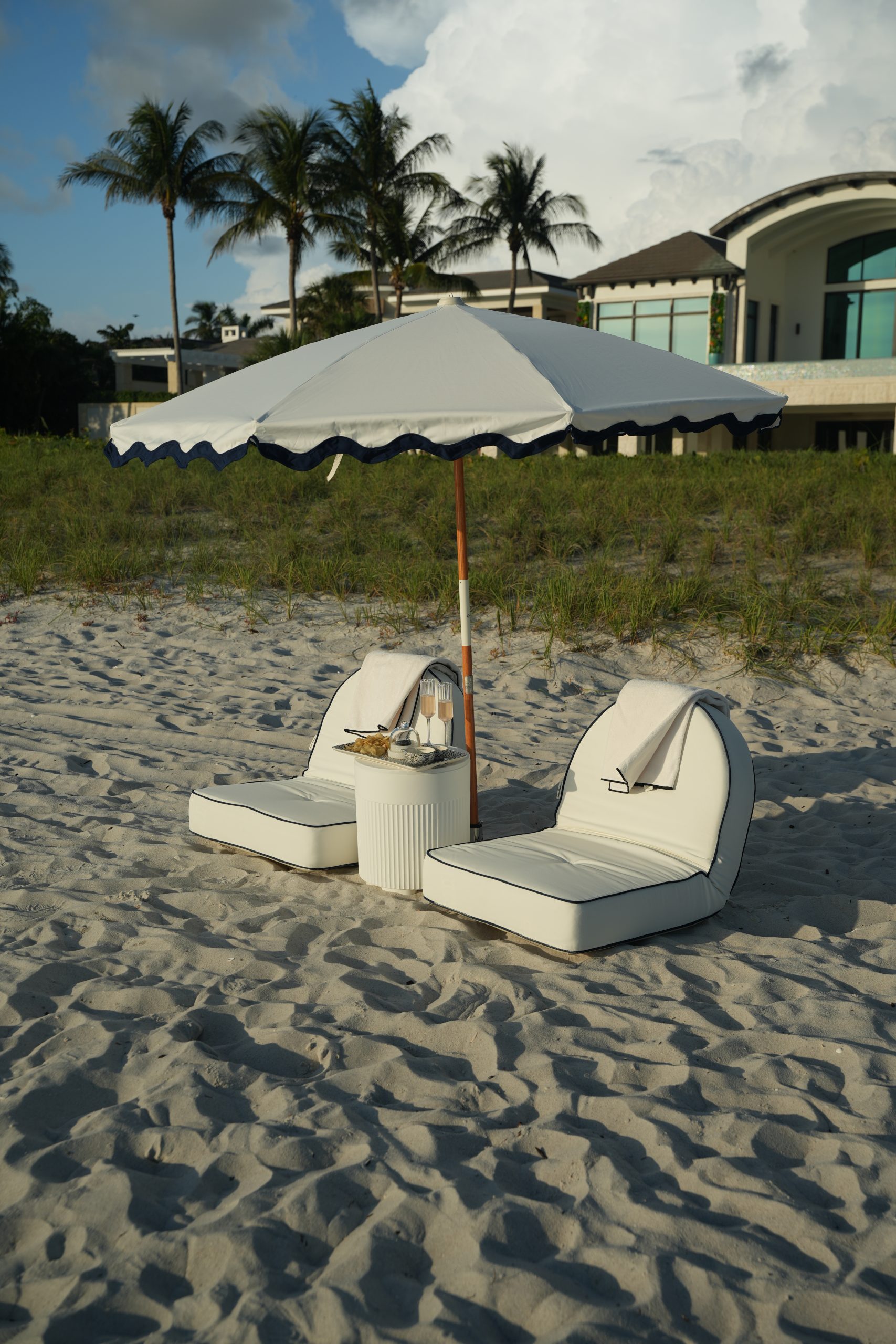 Striped fringe umbrellas along the shoreline in Naples