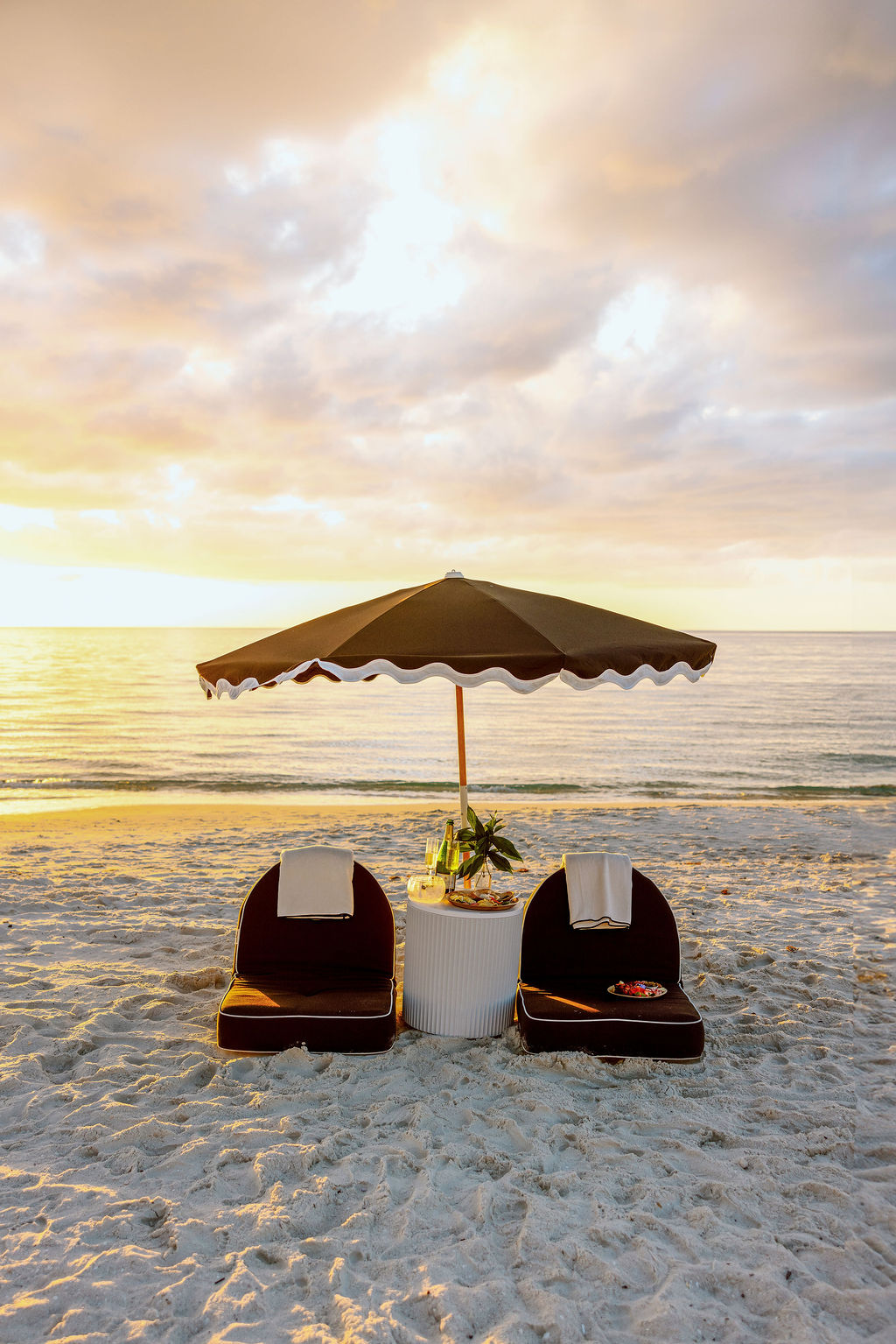 A styled beach setup at golden hour